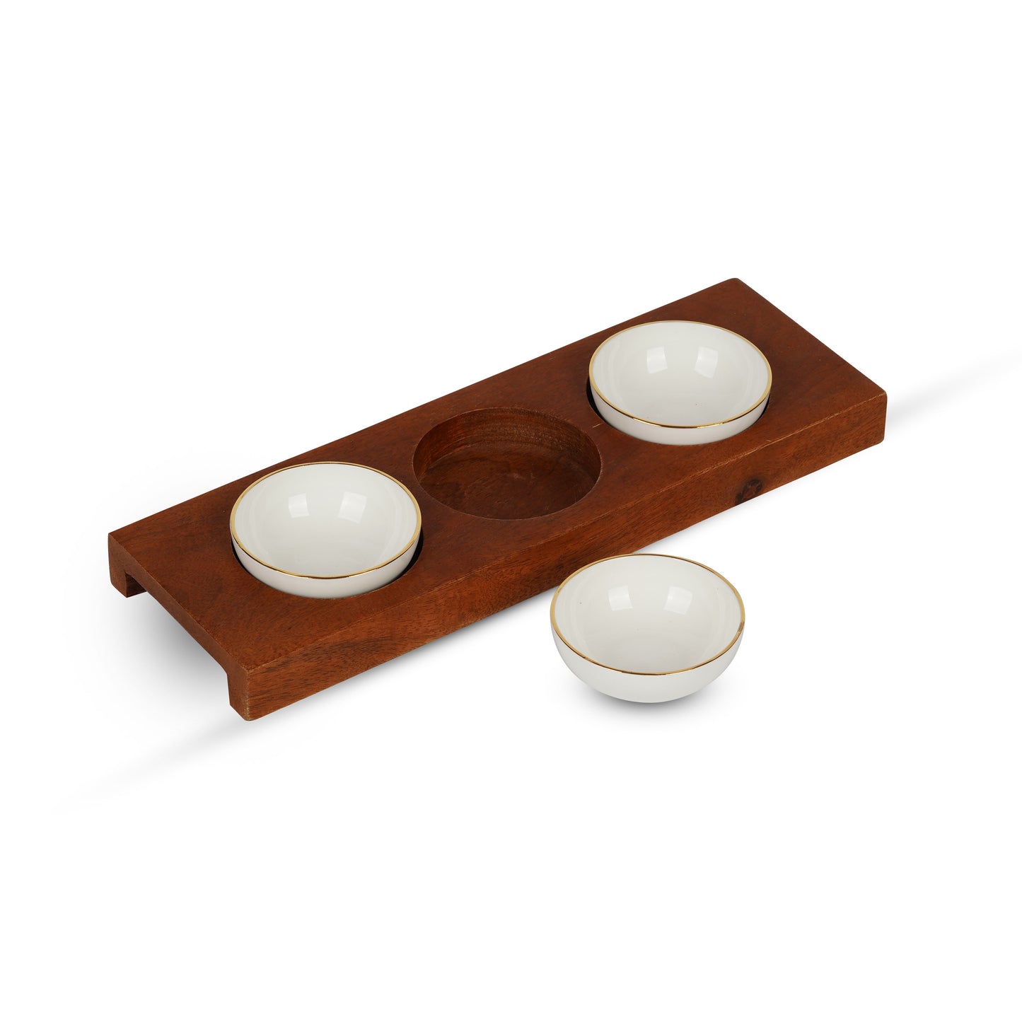 Three round gold-lined bone china chutney bowls neatly arranged on a rustic wooden serving tray