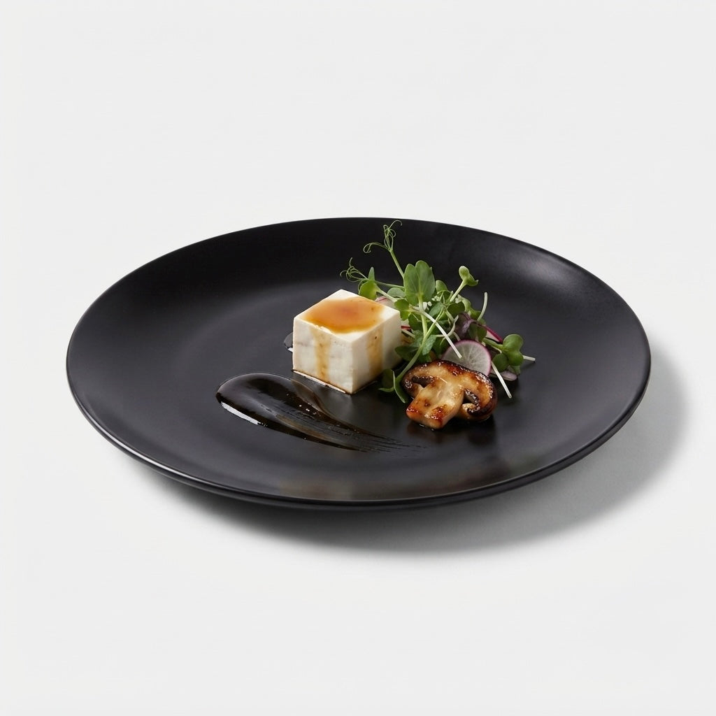 Black Matt Ceramic Sattva Full Plates styled on a dining table with contemporary table setting