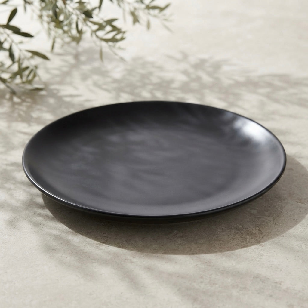 Side angle of Black Matt Ceramic Sattva Full Plates featuring sleek profile and matte finish