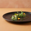 Black Matt Ceramic Sattva Quarter Plates styled on a dining table with contemporary décor